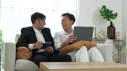An LGBTQ couple, consisting of a gay man and a straight man, are relaxing on vacation at their holiday home.