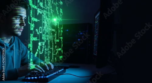 Focused cybersecurity professional analyzing digital data in high-tech server room environment