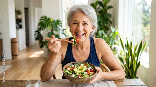 A healthy lifestyle for elderly: happy mature female enjoying organic food and nutrition.
