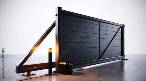 Industrial sliding gate mechanism featuring a heavy duty black metal frame with an integrated warning light and motor unit positioned on a smooth concrete floor against a neutral background