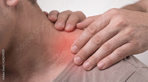 Extreme Close-Up of Hands Performing Deep Tissue Massage on Sore Shoulder Muscle