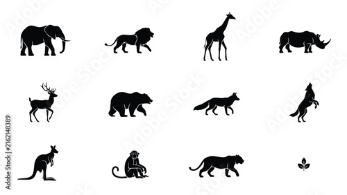 Black silhouettes of various wild animals on white background with animals including elephant lion giraffe rhinoceros rhinoceros deer bear