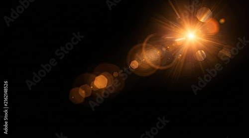 Golden Lens Flare Effect with Bokeh and Light Streaks on Black Background