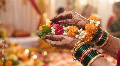 Woman Hands with Bangles Offering Flowers in Puja – Teej Festival Devotional Worship Close Up with Warm Lights.