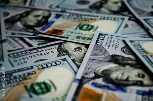 Video of floating 100 dollar banknotes rotating in a circular motion from an angled perspective. Dynamic money background in 4K resolution Finance concept Slow motion