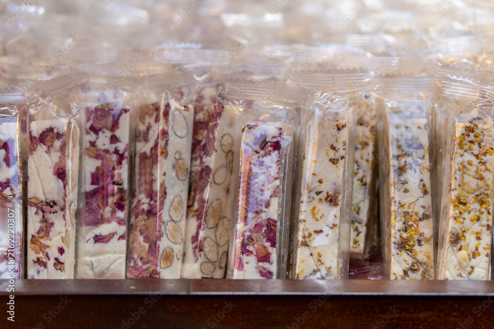 Obraz premium Rose Petal and Nut Nougat Packaging Close Up