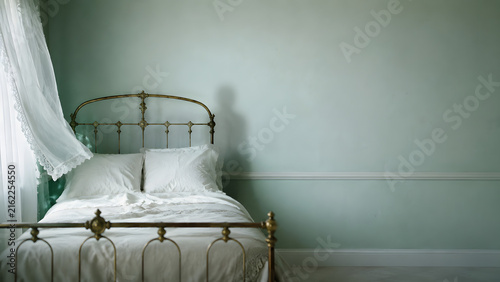 Ghost shadow in abandoned bedroom with vintage metal bed, spooky haunted house interior and paranormal concept