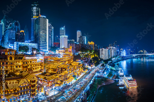 Hongyadong stilt building complex illuminated at night, Chongqing skyline, China. panoramic view