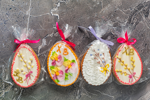 Fotografie Delicate hand-decorated cookies displayed attractively in bright wrappers for a