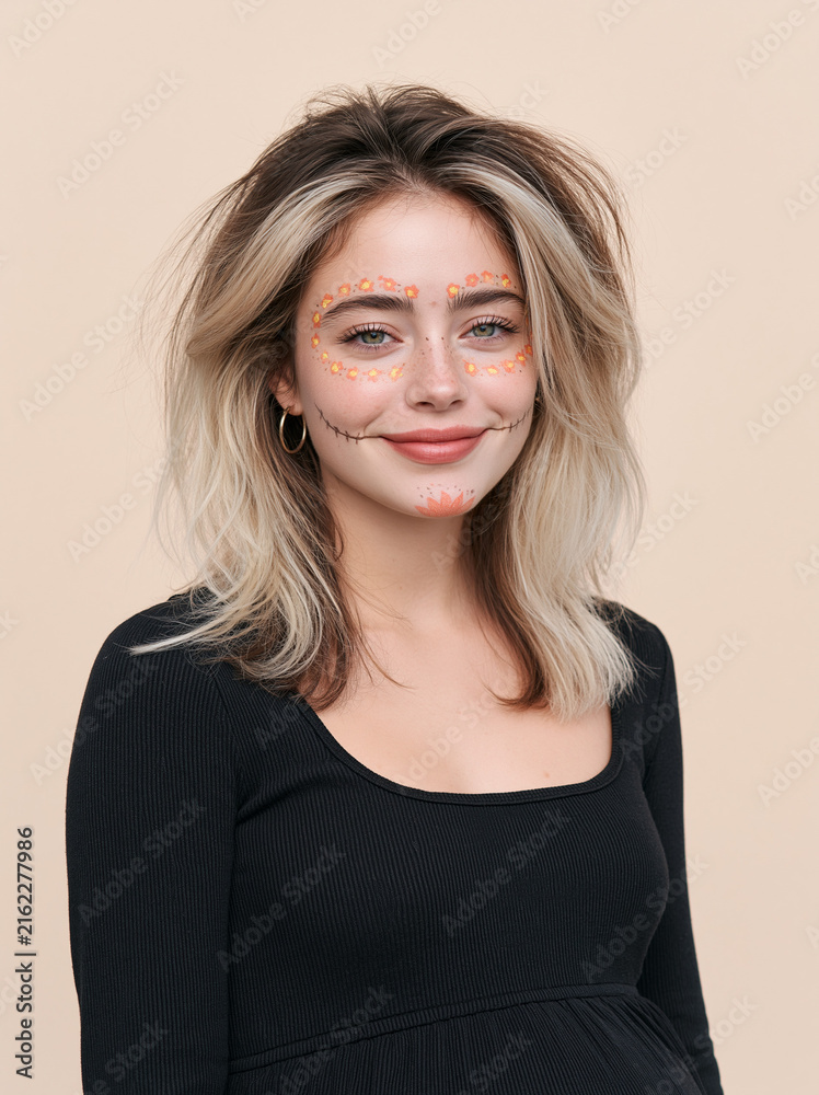 Obraz premium Portrait of beautiful young woman with Halloween floral face painting and stitched smile makeup