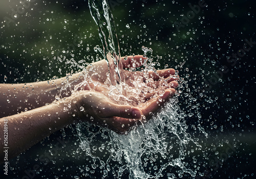 Water splashing into hands