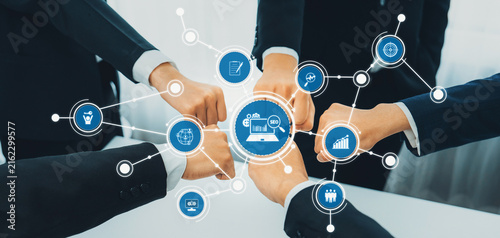 Картината върху платно This image showcases a dynamic team collaboration concept featuring a fist bump gesture surrounded by digital icons representing innovation and business growth strategies