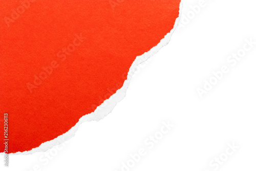 Close-up red torn paper corner with curved white edge