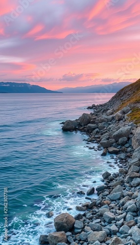 Rocky shoreline along the peninsula with distant mountain views, mountains, Patagonia