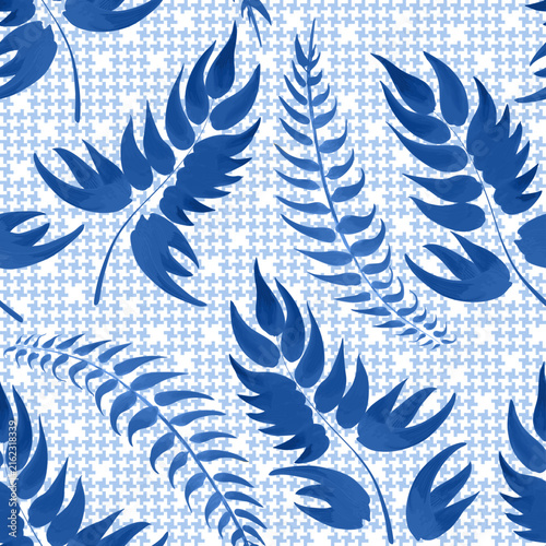 Vector seamless pattern with hand painted blue leaves on a blue and white hounds tooth pattern backdrop