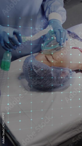 Animation of cardiograph over diverse surgeons operating on patient at hospital