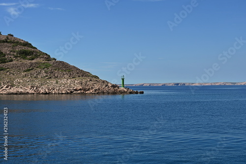 Scenic view of Adriatic coast and a small lighthouse