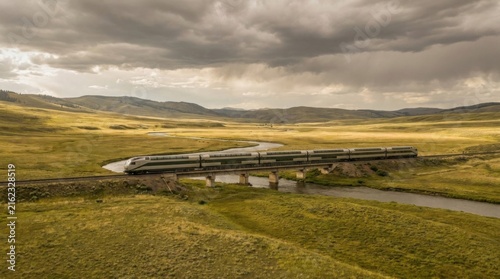 Remote Scenic Road Crossing Open Highland Landscape Under Cloudy Sky