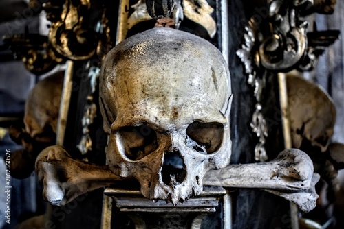 Close-up of a skull and crossbones decoration in a bone church ossuary in Kutna Hora