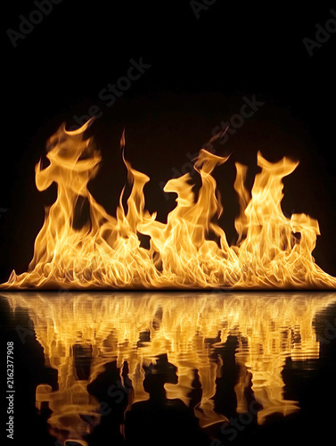 Bright fire flames with water reflection isolated on black background