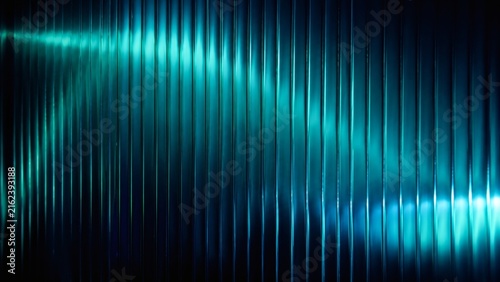 Futuristic cyan vertical stripes background with glowing light effects. Abstract teal linear pattern for technology presentations. Dark turquoise geometric texture for modern web design.