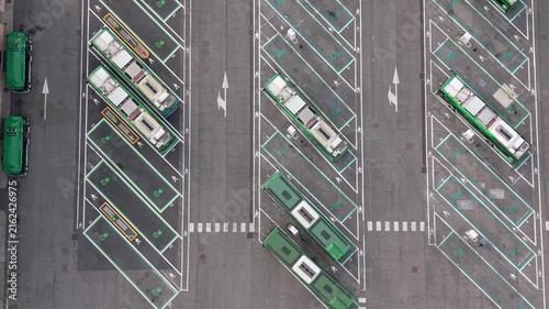 Aerial view of electric buses parked at charging stations in San Donato Milanese, Milan, Italy, illustrating modern public transport and clean energy infrastructure.
