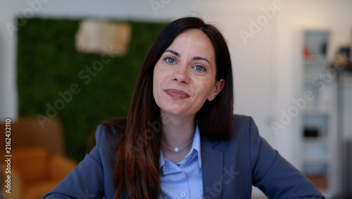 Professional business woman smiling during video conference