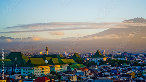 A beautiful view of the city of Malang with Mount Arjuno in the background.