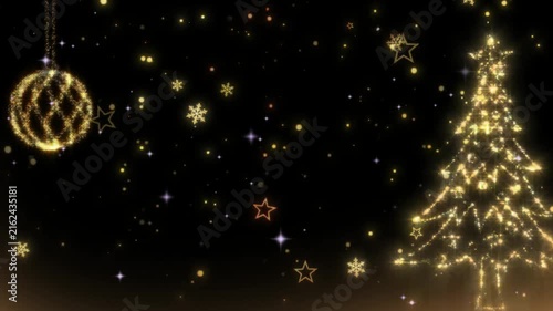 Christmas tree created from golden lights shines on a black background.