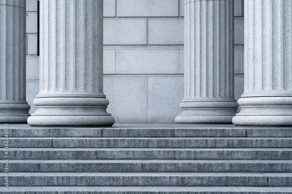 Fototapeta premium Majestic Marble Columns and Stone Steps Evoking Justice, Authority, and Grand Architecture