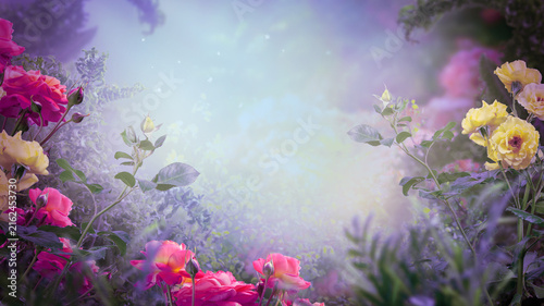 Fantasy blooming pink and yellow roses flowers in fairy tale magical garden, whimsical fairytale glade wallpaper background, magic tranquil misty landscape template, scene with empty copy space.