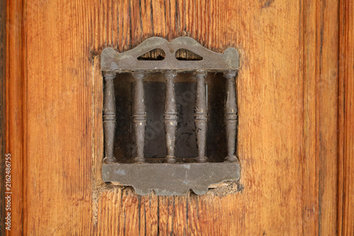 Vintage wooden door with wrought iron details
