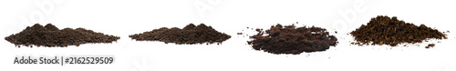 Фотография Four separate mounds of rich dark soil and potting mix, ready for gardening and planting