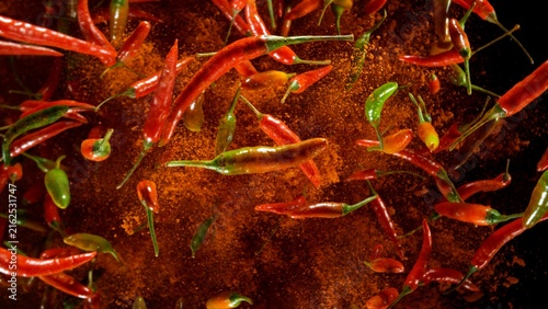 Freeze Motion Shot of Flying Red Chili Peppers