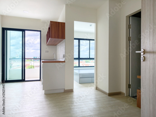 Empty modern apartment room interior with small kitchen counter