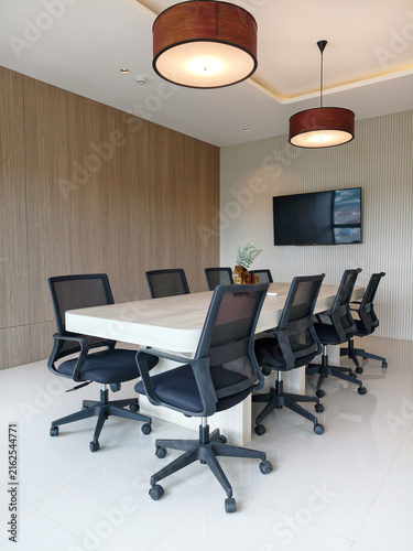 Modern boardroom table with black mesh chairs interior view