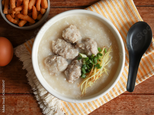 Congee or rice porridge top with minced pork, ginger and green onion. Popular breakfast bowl in China, Thailand, and Asia.