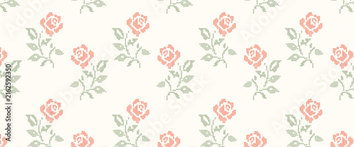 Cross-stitch embroidery roses seamless pattern horizontal banner on cream background. A geometric pixelated needlework vintage floral wallpaper for cottagecore crafts, website headers, fabric design.