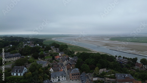 Panoramic aerial view of Saint-Valery-sur-Somme medieval town with the vast Somme Bay in the background, France
