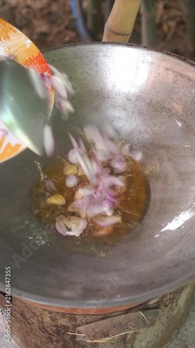 Cooking Thai sweet and sour eggs (Kai Look Khuey). Deep-frying hard-boiled eggs until golden, simmering palm sugar with tamarind, and dressing over eggs.