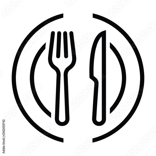 Black and white plate with fork and knife on table setting