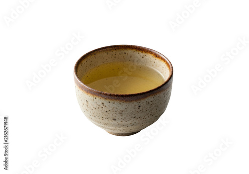Traditional japanese ceramic tea cup filled with green tea isolated on transparent background