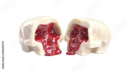 Two halves of cream skull filled with red jam