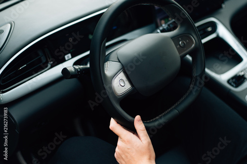 Принти на полотні Driver Holds Steering Wheel While Driving on a Road
