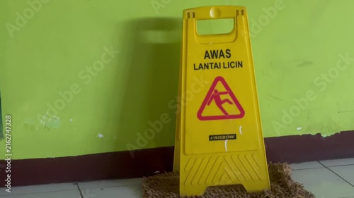 Caution Wet Floor Safety Sign in Public Indoor Area