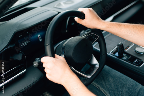 Konstfotografi Driver Holds Steering Wheel While Driving on a Road