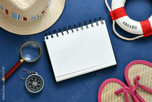 Картината върху платно Travel vacation planning flat lay with blank notebook, compass, lifebuoy and sum
