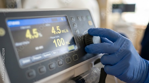 Radiology Technologist Programming a Contrast Injector Pump with the Correct Flow Rate and Volume