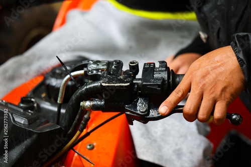 фотографія Motorcycle handlebar motorcycle handlebar hand mechanic maintenance repair contr