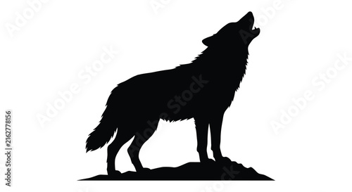 Howling wolf stands on mound black silhouette